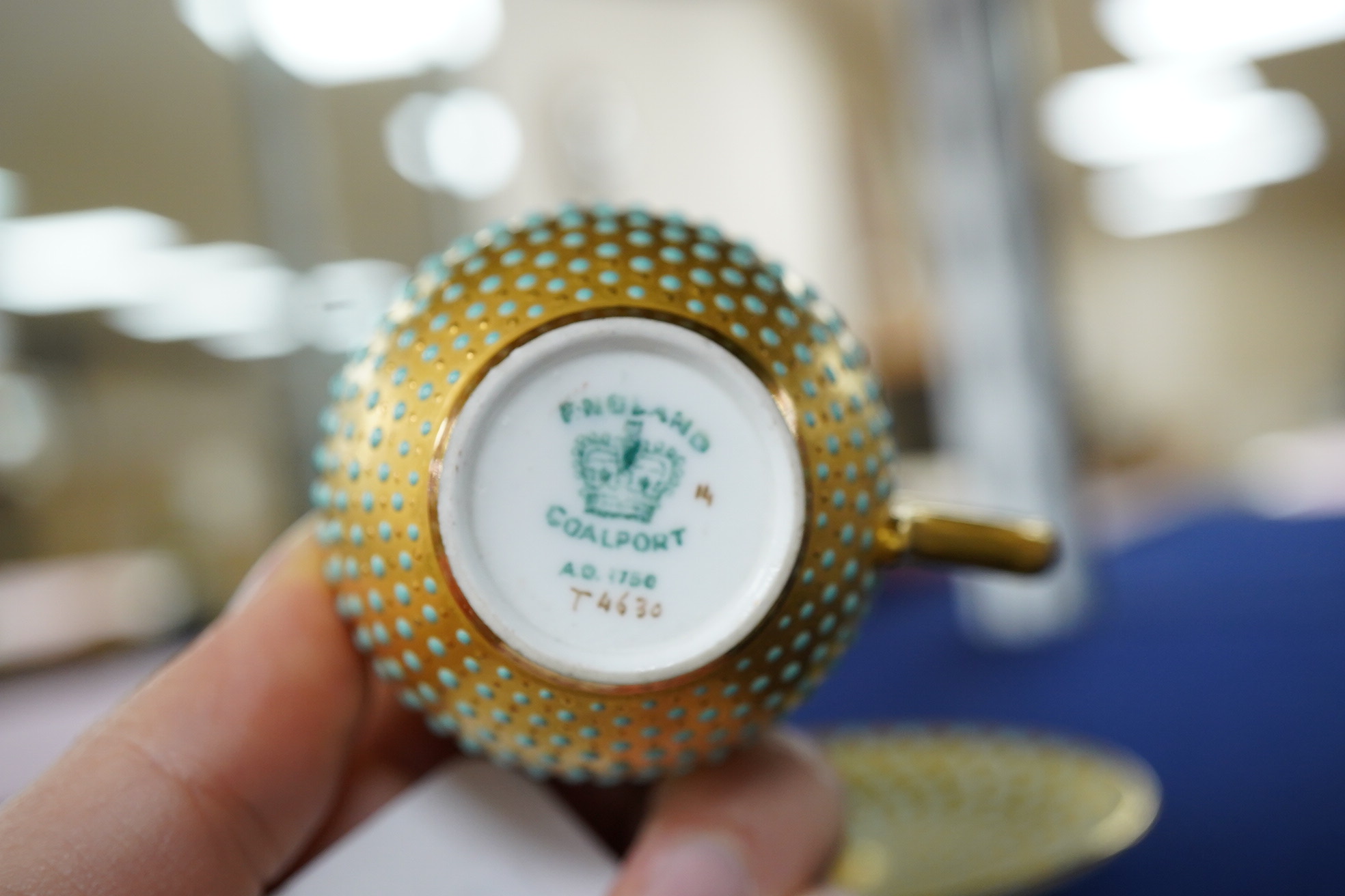 An early 20th century Coalport jewelled cabinet cup and saucer, a Karl Ens grop and a Plane figure